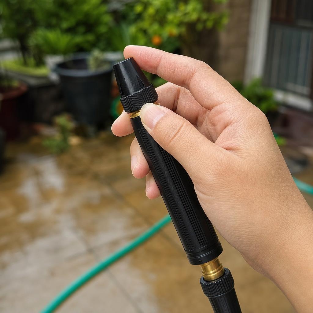 Mano ajustando la boquilla del pico de alta presion